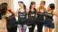Bridesmaids in matching tank tops celebrating before a wedding.