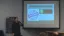 Presentation slide about applying for programs, featuring a stamp and a dollar sign icon.