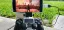 Mobile gaming setup showcasing a controller connected to a smartphone displaying a gaming scene.