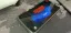 A smartphone displaying the title screen of the game "Stranger Things".