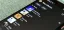 Music library interface on a smartphone displaying playlists and albums.