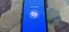 Smartphone displaying the Shazam app interface with a prompt to tap to listen.